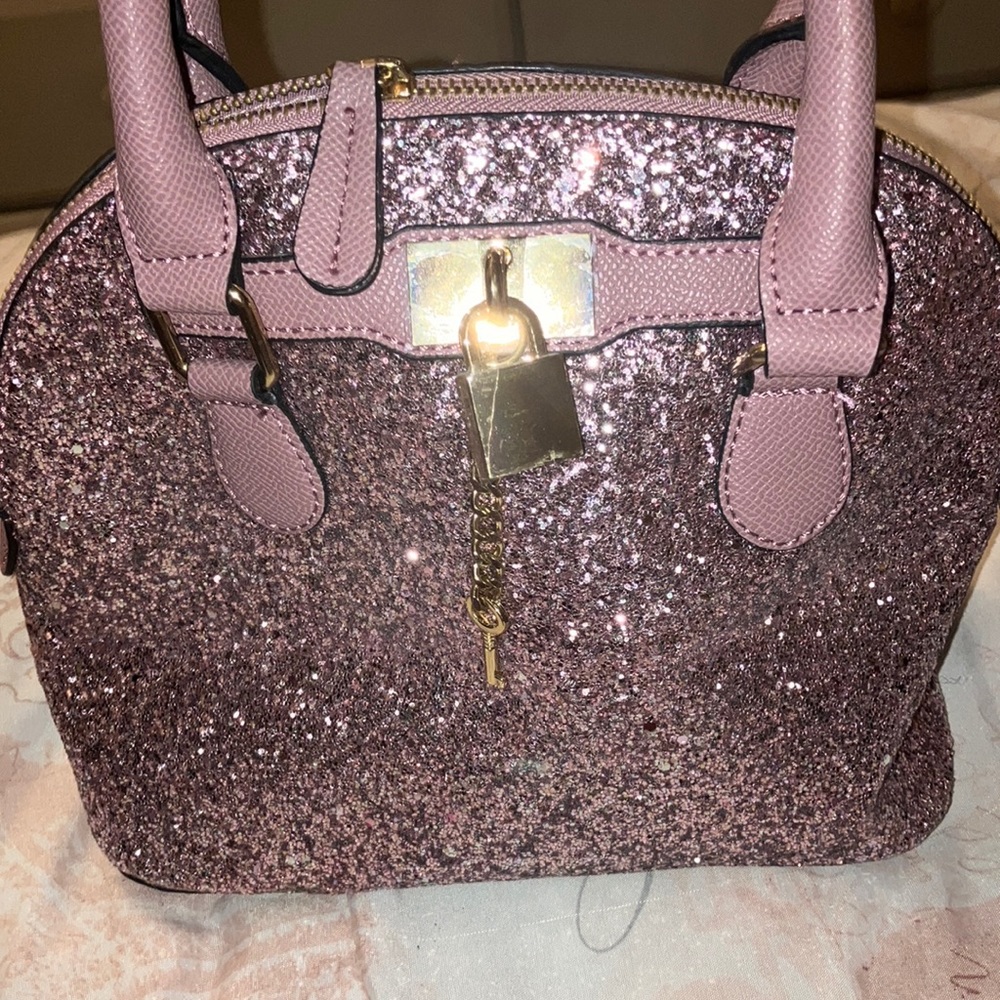 Also glitter purse in good condition